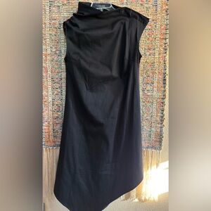 Black asymmetrical dress. Simple and sophisticated. Snap buttons on shoulder.